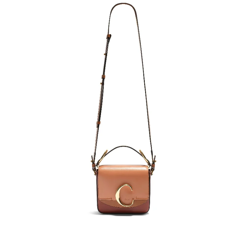 Canvas Bucket Bag in Navy Blue with Striped Interior for a Nautical - Inspired OutfitMini C Tricolour Bag in Brown Canvas Bucket Bag in Navy Blue with Striped Interior for a Nautical - Inspired OutfitMini C Tricolour Bag in Brown