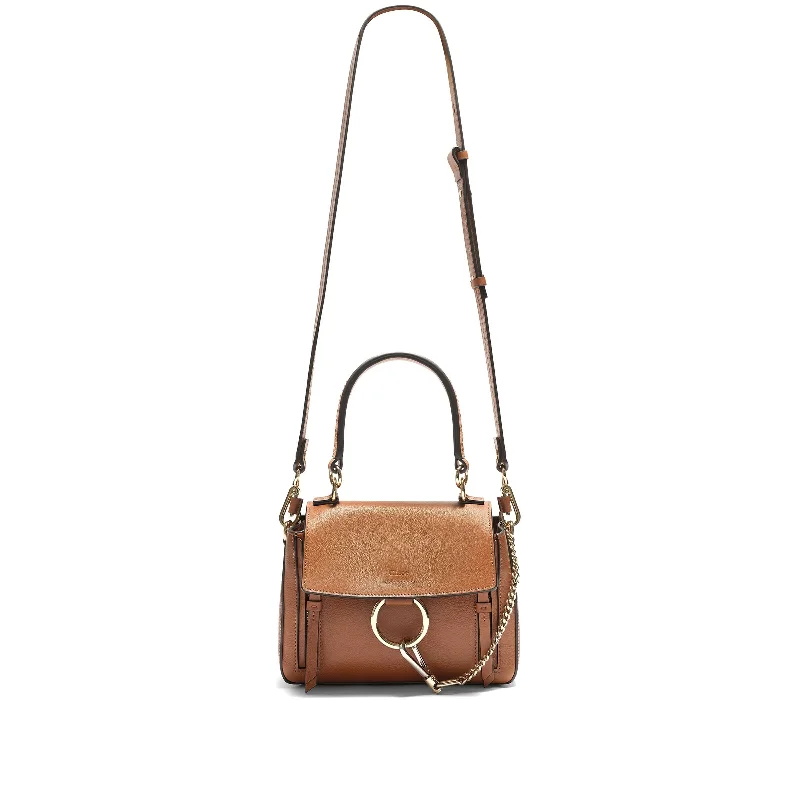 PVC Bucket Bag in Clear with Glitter Accents for a Fun and Edgy StyleFaye Mini Day Bag in Brown PVC Bucket Bag in Clear with Glitter Accents for a Fun and Edgy StyleFaye Mini Day Bag in Brown