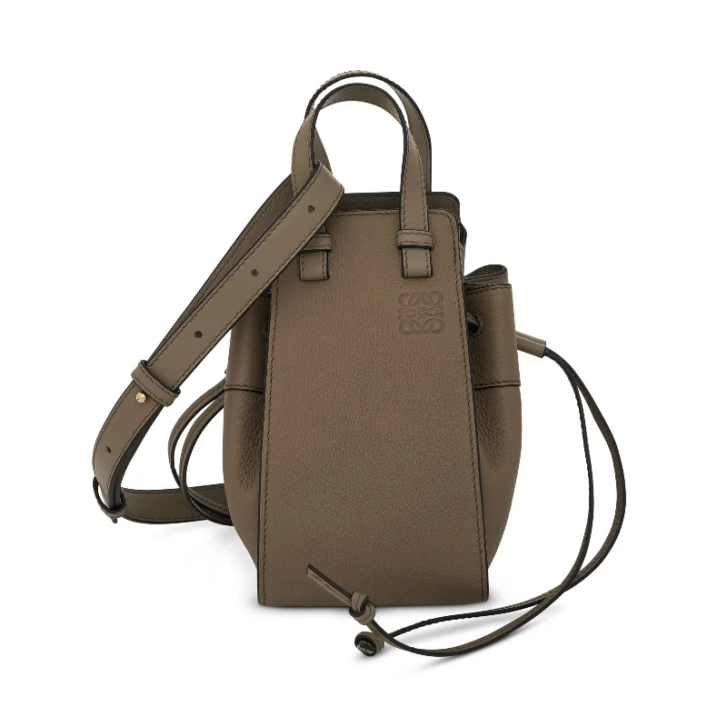 Rattan Bucket Bag in Natural Color with Beadwork for a Tropical VacationMini Hammock Drawstring in Soft Grained Calfskin in Laurel Green