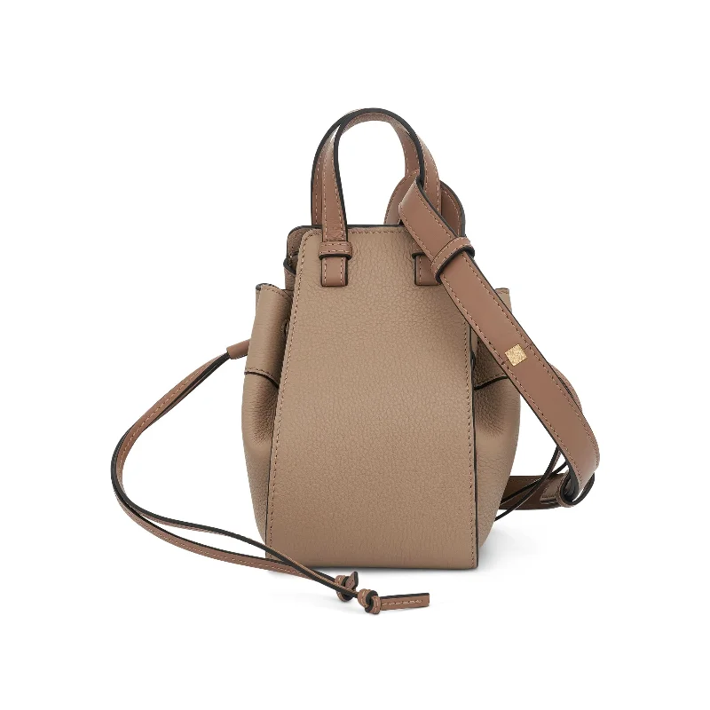 Faux Fur - Lined Bucket Bag in White for a Cozy Winter AccessoryMini Hammock Drawstring in Soft Grained Calfskin in Sand