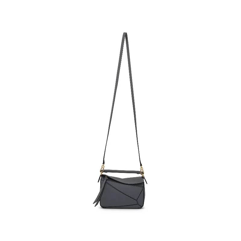 Bucket Bag with Embossed Animal Print in Tan for a Wild and Stylish StatementMini Puzzle Bag in Soft Grained Calfskin in Asphalt Grey