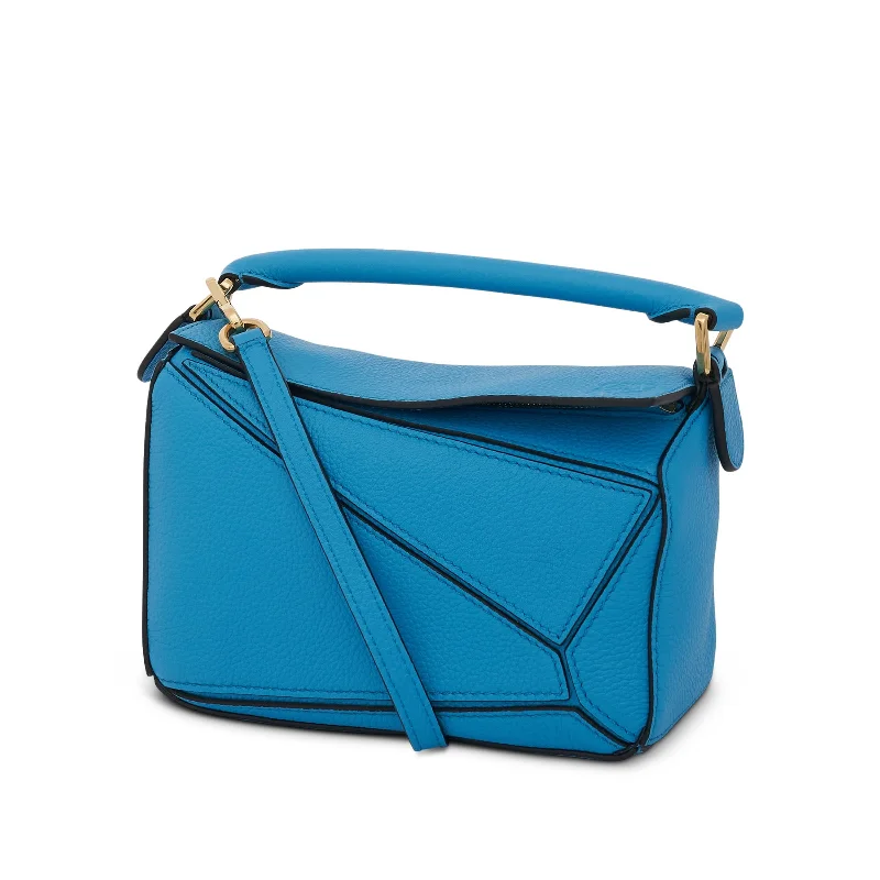 Women's Bucket Bag with Adjustable Shoulder Strap in Orange for Comfort on the GoMini Puzzle Bag in Soft Grained Calfskin in Cyan