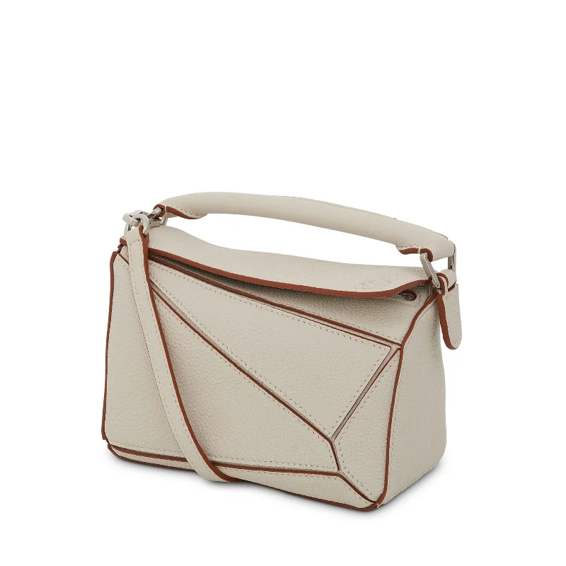 Women's Quilted Bucket Bag in Black with Silver Hardware for a Classic and Timeless StyleMini Puzzle Bag in Soft Grained Calfskin in Soft White