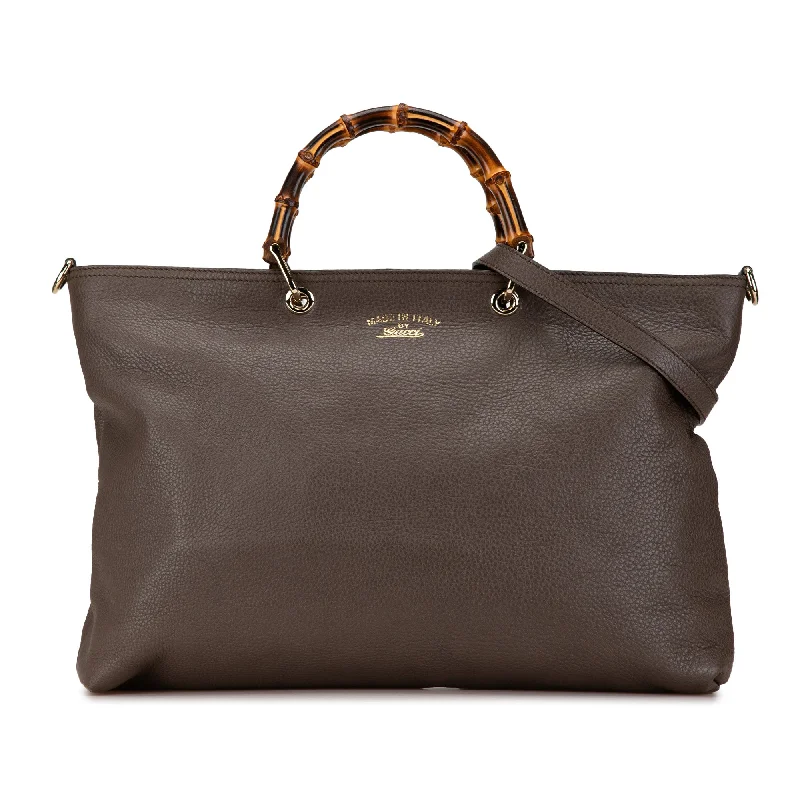 Embroidered Denim Shoulder Bag in Blue for a Vintage VibeBrown Gucci Large Calfskin Bamboo Shopper Satchel