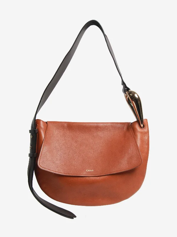 Leather Shoulder Bag with Magnetic Closure in Black for Quick AccessBrown Kiss Hobo leather shoulder bag
