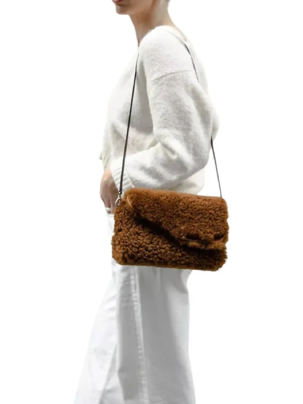 Women's Shoulder Bag with Fringe Details in Brown for a Bohemian StyleWomen's Corinaldo Shearling Bag In Castagna Brown